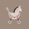 Vector retro rocking kids toy beige horse with branches and heart decoration.