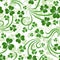 Vector seamless background with shamrock.