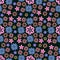 Vector seamless floral background with a pattern of different small flowers in pastel colors on a black background