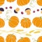Vector seamless pattern of autumn harvest symbols: pumpkins, wheat ears, berries, mushrooms in flat style