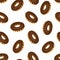 Vector seamless pattern with chocolate donuts.