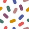 Vector seamless pattern with colorful oval elements like pills or candy. Minimal trendy and modern style of graphics