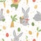 Vector seamless pattern with cute funny Easter bunnies, colored eggs and carrots.