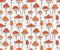 Vector seamless pattern with cute red fly-agaric amanita mushrooms.