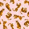 Vector seamless pattern with cute tigers on the pink background. Circus animal show. Fabric design.