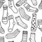 Vector seamless pattern of doodle socks for web design, prints etc. Repeating background can be copied without any seams