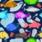 Vector seamless pattern with fish swims among the garbage. Stop plastic ocean pollution. Marine life under threat