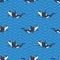 Vector seamless pattern with killer whales or orcas in the sea.