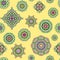 Vector seamless pattern from mandalas on yellow background