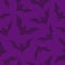 Vector seamless pattern with purple bats.