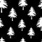 Vector seamless pattern texture of white carved Christmas fir trees on a black background
