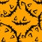 vector seamless pattern of triangular eyes and a black jack pumpkin smile on an orange background for a Halloween design