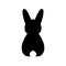 Vector Silhouette of a black rabbit on a transparent background. Back view. Easter Bunny