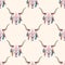 Vector tribal seamless pattern with bull skull and ethnic feathers.