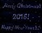 Vector words Merry Christmas!, 2016 and Happy New Year! written in stars on space starry background