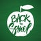 Vectro illustration: Hand drawn type lettering of Back to School and apple on chalkboard background.