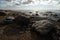 Veczemju Klintis - Boulder beach in Baltic country Latvia in April 2019 - Cloudy sky with dull clouds and a bit of sun