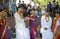 Vedic wedding. Brides and grooms in wedding dresses standing on the ground during the marriage ceremony