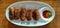 Veg cutlet, wooden background, white plate