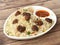 Veg manchurian fried rice, made of fried mixed vegetables balls along with rice is tossed in soy tomato based sauce, indo chinese