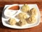 Veg steam momo. Nepalese Traditional dish Momo stuffed with vegetables and then cooked and served with sauce and mayonnaise over a