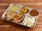 Veg Thali from an indian cuisine, food platter consists variety of veggies, lentils,rice,roti etc., selective focus