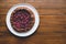 Vegan almond berry galette on wooden rustic background.