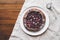 Vegan almond berry galette on wooden rustic background.