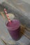 Vegan berry smoothie on a wood backgroud