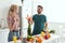 vegan boyfriend presenting bouquet of carrots to girlfriend