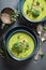 Vegan broccoli soup served in blue bowl