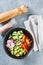 Vegan buddha bowl. Healthy vegetarian salad with cherry tomatoes, cucumber, radish,, avocado and lettuce