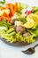 Vegan buddha bowl salad with vegetables, tofu, black beans meatballs and avocado. Healthy vegan food concept.