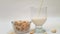 Vegan cashew milk pouring in a glass, closeup view, Healthy non dairy milk alternative.