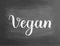 Vegan chalkboard blackboard text writing handwritten text, chalk on a blackboard, vector illustration. Logo for healthy