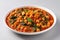 Vegan Chickpea Spinach Stew On White Round Plate On White Background. Generative AI
