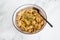 Vegan creamy artichoke pasta with homemade dairy-free bechamel sauce, healthy plant-based food