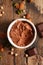 Vegan creamy chocolate mousse on wood background