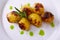 Vegan cuisine. Grilled baby potatoes with rosemary. Shallow dof.