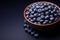 Vegan delight Fresh, sweet blueberries adorn a ceramic serving bowl