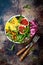 Vegan, detox Buddha bowl recipe with turmeric roasted tofu, figs, chickpeas and greens. Top view
