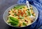 Vegan Farfalle pasta with spinach sauce with fried chickpeas.