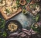 Vegan food  background with roasted  cauliflower vegan steaks with pesto and nuts on dark rustic kitchen  table,  top view.  Copy
