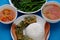 Vegan food, boiled vegetables, tofu cheese, rice, fried egg mugwort