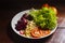 Vegan food. Plate of lettuce, beet, fava and tomato