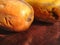 a vegan food, two ripe papaya fruit on a wooden table