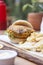 Vegan hamburger, with carrots, lentils, peppers and onions, served with french fries