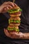 Vegan healthy burgers in manâ€™s hands. Vegan beet chickpea burg