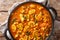 Vegan Indian Mushroom Curry with Spinach, Tomatoes and Chickpeas closeup. horizontal top view
