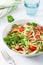 Vegan ketogenic spiralized courgette salad with avocado tomato pumpkin seeds